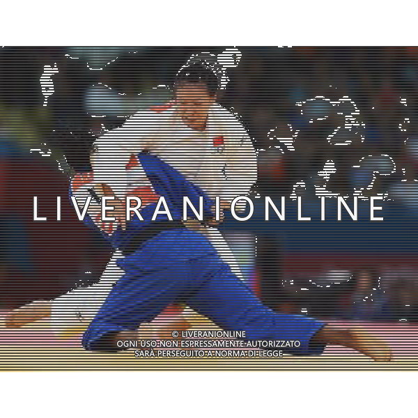 (120731) -- LONDON, July 31, 2012 () -- Xu Lili of China (in white) competes with Edwige Gwend of Italy during women\'s Judo 63kg elimination round of 16 contest, at London 2012 Olympic Games in London, Britain, on July 31, 2012.Xu Lili of China won. (/Wu Xiaoling) (nxl) ©photoshot/AGENZIA ALDO LIVERANI SAS - ITALY ONLY - Giochi Olimpici - Olimpiadi Londra 2012