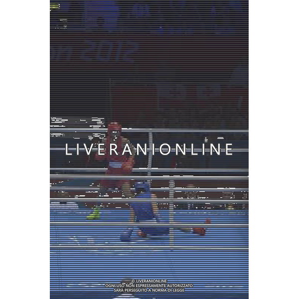 Devendro Singh Laishram (Red) from India against Bayron Molina Figueroa (Blue) from Honduras seen during Men\'s Light Fly (49kg) Mens Boxing London 2012 Olympic Games held at the Excel. London /ALDO LIVERANI SAS-ITALY ONLY - EDITORIAL USE ONLY