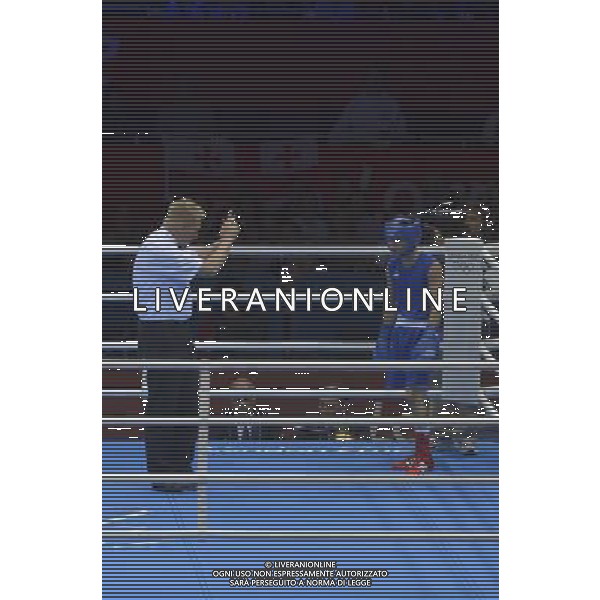 Bayron Molina Figueroa (Blue) from Honduras takes a standing count Indias Devendro Singh Laishram (Red) seen during Men\'s Light Fly (49kg) Mens Boxing London 2012 Olympic Games held at the Excel. London /ALDO LIVERANI SAS-ITALY ONLY - EDITORIAL USE ONLY