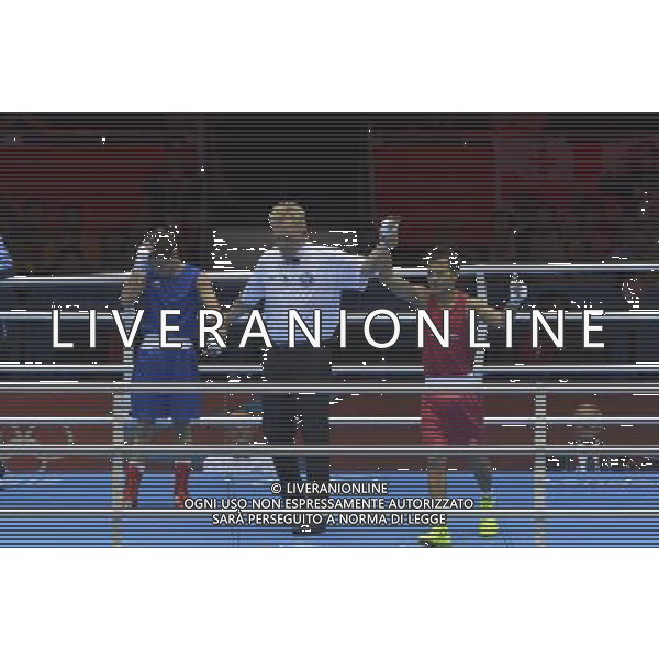 Devendro Singh Laishram (Red) from India wins his bout against Bayron Molina Figueroa (Blue) from Honduras seen during Men\'s Light Fly (49kg) Mens Boxing London 2012 Olympic Games held at the Excel. London /ALDO LIVERANI SAS-ITALY ONLY - EDITORIAL USE ONLY
