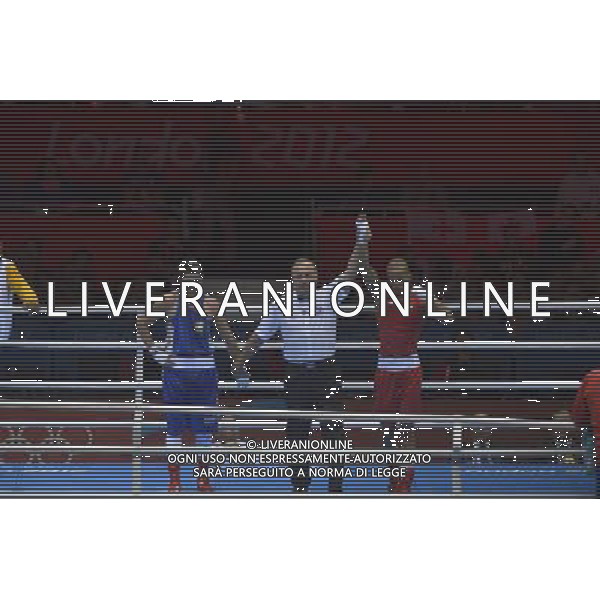 Roniel Iglesias Sotolongo (Red) from Cuba wins his bout against Cesar Villarraga Aldana (Blue) from Columbia seen during Men\'s Light Welter (64kg) Mens Boxing London 2012 Olympic Games held at the Excel. London /ALDO LIVERANI SAS-ITALY ONLY - EDITORIAL USE ONLY