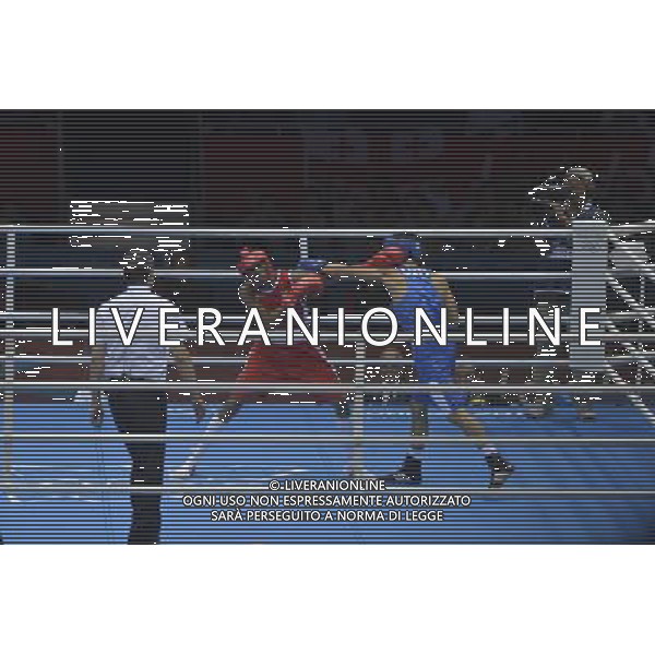Anderson Rojas Mina (Red) from Ecuador seen against Uktamjon Rahmonov (Blue) from Uzbekistan seen during Men\'s Light Welter (64kg) Mens Boxing London 2012 Olympic Games held at the Excel. London /ALDO LIVERANI SAS-ITALY ONLY - EDITORIAL USE ONLY