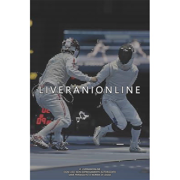 Kenta Chida (L) from Japan against Victor Sintes (R) from France seen during Men\'s Individual Foil event London 2012 Olympic Games held at the Excel. London olympics stadium /ALDO LIVERANI SAS-ITALY ONLY - EDITORIAL USE ONLY