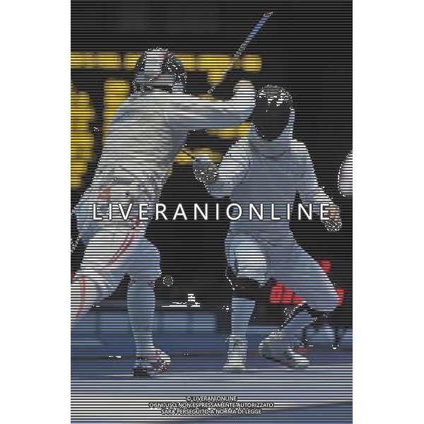 Kenta Chida (L) from Japan against Victor Sintes (R) from France seen during Men\'s Individual Foil event London 2012 Olympic Games held at the Excel. London olympics stadium /ALDO LIVERANI SAS-ITALY ONLY - EDITORIAL USE ONLY