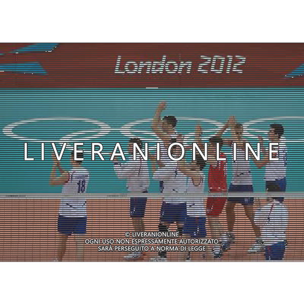 (120731) -- LONDON, July 31, 2012 () -- Volleyball player of Serbia celebrates victory after the men\'s preliminary pool B volleyball match against Tunis at London 2012 Olympic Games, July 31, 2012, London, Britain. Serbia won the match 3-1. (/Li Gang) /ALDO LIVERANI SAS-ITALY ONLY - EDITORIAL USE ONLY