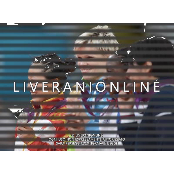 (120731) -- LONDON, July 31, 2012 () -- Gold medalist Urska Zolnir of Slovenia (2nd L), silver medalist Xu Lili of China (1st L), bronze medalists Gevrise Emane of France (3rd L) and Yoshie Ueno of Japan attend victory ceremony of women\'s Judo 63kg competition, at London 2012 Olympic Games in London, Britain, on July 31, 2012. (/Wu Xiaoling) (nxl) /ALDO LIVERANI SAS-ITALY ONLY - EDITORIAL USE ONLY