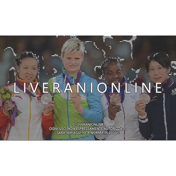 (120731) -- LONDON, July 31, 2012 () -- Gold medalist Urska Zolnir of Slovenia (2nd L), silver medalist Xu Lili of China (1st L), bronze medalists Gevrise Emane of France (3rd L) and Yoshie Ueno of Japan attend victory ceremony of women\'s Judo 63kg competition, at London 2012 Olympic Games in London, Britain, on July 31, 2012. (/Wu Xiaoling) (nxl) /ALDO LIVERANI SAS-ITALY ONLY - EDITORIAL USE ONLY
