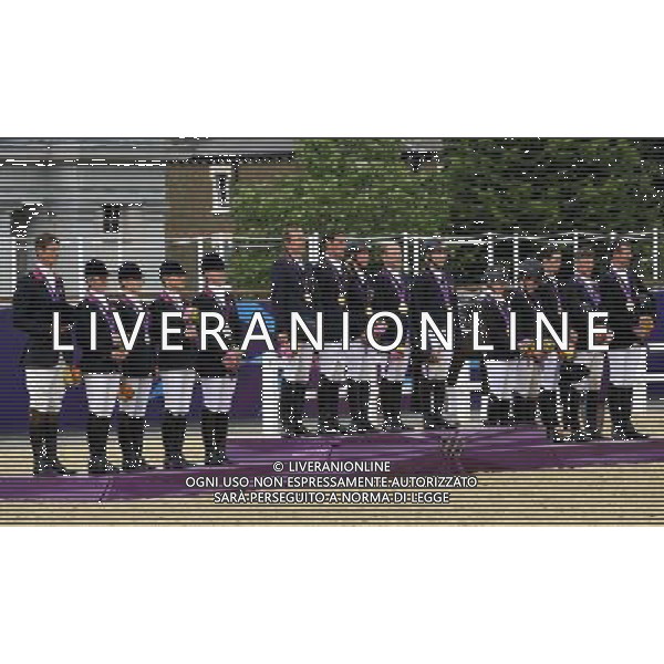 (120731) -- LONDON, July 31, 2012 () -- The teams of Germany, Britain and New Zealand attend the awarding ceremony of equestrian team eventing at the London 2012 Olympic Games in London, Britain, July 31, 2012. German team claimed the title of this event. (/Gesang Dawa)(zgp) /ALDO LIVERANI SAS-ITALY ONLY - EDITORIAL USE ONLY