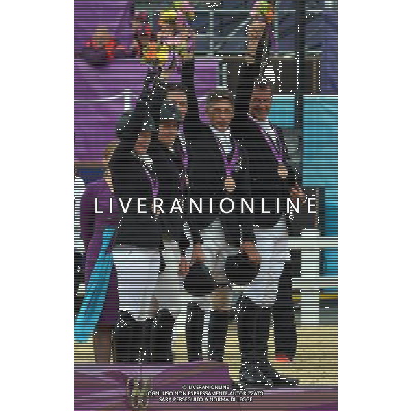 (120731) -- LONDON, July 31, 2012 () -- The team of New Zealand attend the awarding ceremony of equestrian team eventing at the London 2012 Olympic Games in London, Britain, July 31, 2012. German team claimed the title of this event. (/Gesang Dawa)(zgp) /ALDO LIVERANI SAS-ITALY ONLY - EDITORIAL USE ONLY