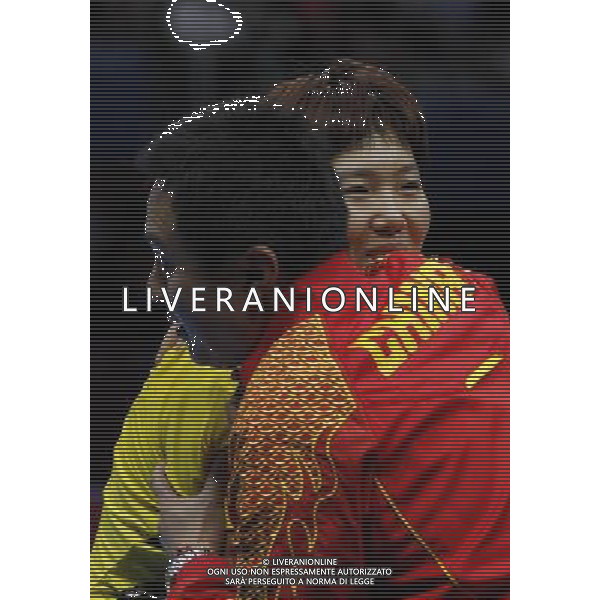 (120731) -- LONDON, July 31, 2012 () -- Li Xiaoxia of China hugs her coach Shi Zhihao after the semifinal match of women\'s singles table tennis event against Kasumi Ishikawa of Japan at London 2012 Olympic Games, London, Britain, July 31, 2012. Li Xiaoxia won the match 4-1 and advanced to the final. (/Shen Bohan) /ALDO LIVERANI SAS-ITALY ONLY - EDITORIAL USE ONLY