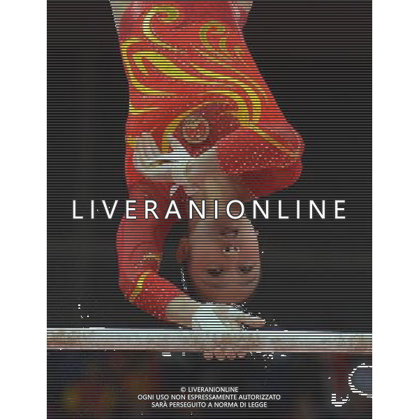 (120731) -- LONDON, July 31, 2012 () -- Huang Qiushuang of China competes on uneven bars during Gymnastics Artistic women\'s team final competition at London 2012 Olympic Games in London, Britain, July 31, 2012. The Chinese team ranked the fourth in this event. (/Cheng Min) (zgp) /ALDO LIVERANI SAS-ITALY ONLY - EDITORIAL USE ONLY