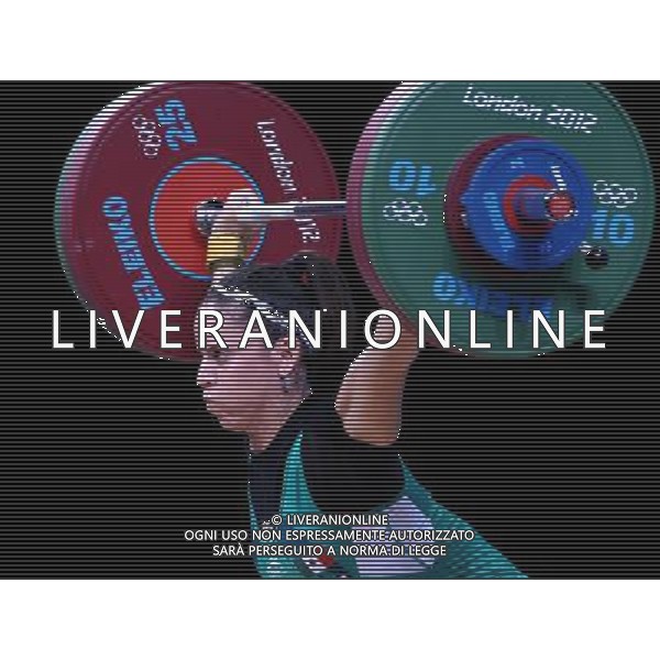 (120731) -- LONDON, July 31, 2012 () -- Luz Mercedes Acosta Valdez of Mexico competes during women\'s weightlifting 63kg competition, at London 2012 Olympic Games in London, Britain, on July 31, 2012. Luz Mercedes Acosta Valdez of Mexico finished sixth. (/Chen Jianli) (nxl) /ALDO LIVERANI SAS-ITALY ONLY - EDITORIAL USE ONLY