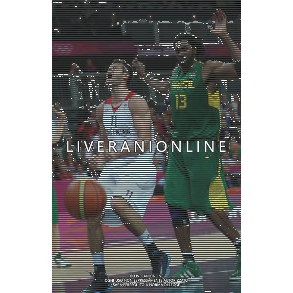 (120731) -- LONDON, July 31, 2012 () -- Freeland Joel of Britain (No.11) competes during men\'s basketball preliminary round group B match between Brazil and Britain, at London 2012 Olympic Games in London, Britain, on July 31, 2012. Brazil defeated Britain 67-62. (/Meng Yongmin) (nxl) /ALDO LIVERANI SAS-ITALY ONLY - EDITORIAL USE ONLY