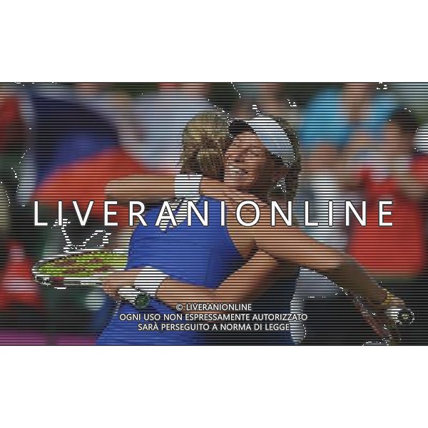 (120731) -- LONDON, July 31, 2012 () -- Andrea Hlavackova and Lucie Hradecka of Czech Republic hug during women\'s tennis doubles second round match, at London 2012 Olympic Games in London, Britain, on July 31, 2012. Li Na/Zhang Shuai of China lost to Andrea Hlavackova/Lucie Hradecka of Czech Republic 0-2. (/Tao Xiyi) (nxl) /ALDO LIVERANI SAS-ITALY ONLY - EDITORIAL USE ONLY