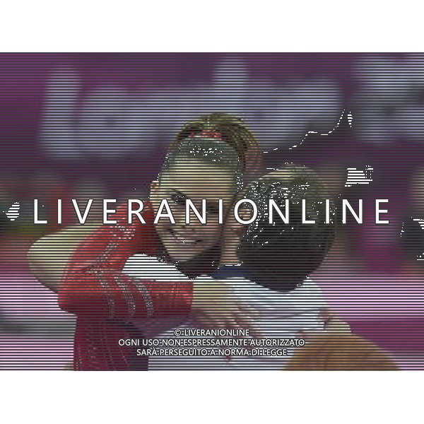 (120731) -- LONDON, July 31, 2012 () -- Alexandra Raisman of U.S. hugs her coach after Gymnastics Artistic women\'s team final competition at London 2012 Olympic Games in London, Britain, July 31, 2012. The U.S. team won gold medal in this event. (/Qi Heng) (zgp) /ALDO LIVERANI SAS-ITALY ONLY - EDITORIAL USE ONLY