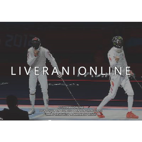 (120731) -- LONDON, July 31, 2012 () ¬C Lei Sheng of China (R) competes with Alaaeldin Abouelkassem of Egypt during men\'s fencing Foil individual gold medal match, at London 2012 Olympic Games in London, Britain, on July 31, 2012. Lei Sheng of China won. (/Zeng Yi) (nxl) /ALDO LIVERANI SAS-ITALY ONLY - EDITORIAL USE ONLY
