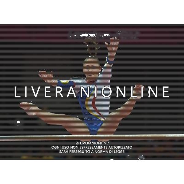 (120731) -- LONDON, July 31, 2012 () -- Diana Maria Chelaru of Romania competes in uneven bars event of Gymnastics Artistic women\'s team final competition at London 2012 Olympic Games in London, Britain, July 31, 2012. The Romanian team won bronze medal in this event. (/Cheng Min) (zgp) /ALDO LIVERANI SAS-ITALY ONLY - EDITORIAL USE ONLY