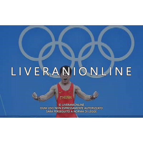 (120731) -- LONDON, July 31, 2012 () -- Lin Qingfeng of China celebrates during men\'s weightlifting 69kg competition, at London 2012 Olympic Games in London, Britain, July 31, 2012. Lin Qingfeng won the gold medal. (/Gong Lei) (zgp) /ALDO LIVERANI SAS-ITALY ONLY - EDITORIAL USE ONLY
