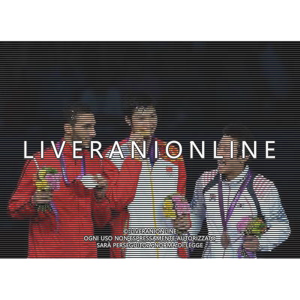 (120731) -- LONDON, July 31, 2012 () ¬C Lei Sheng (C) of China, Alaaeldin Abouelkassem (L) of Egypt, Choi Byungchul of South Korea attend the awarding ceremony of men\'s fencing Foil individual event at London 2012 Olympic Games in London, Britain, July 31, 2012. (/Zeng Yi) (zgp) /ALDO LIVERANI SAS-ITALY ONLY - EDITORIAL USE ONLY