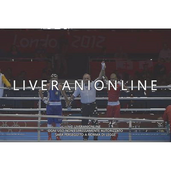 Roniel Iglesias Sotolongo (Red) from Cuba wins his bout against Cesar Villarraga Aldana (Blue) from Columbia seen during Men\'s Light Welter (64kg) Mens Boxing London 2012 Olympic Games held at the Excel. London ©PHOTOSHOT/AGENZIA ALDO LIVERANI SAS - ITALY ONLY - GIOCHI OLIMPICI, OLIMPIADI LONDRA 2012