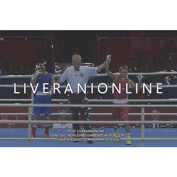 Devendro Singh Laishram (Red) from India wins his bout against Bayron Molina Figueroa (Blue) from Honduras seen during Men\'s Light Fly (49kg) Mens Boxing London 2012 Olympic Games held at the Excel. London ©PHOTOSHOT/AGENZIA ALDO LIVERANI SAS - ITALY ONLY - GIOCHI OLIMPICI, OLIMPIADI LONDRA 2012