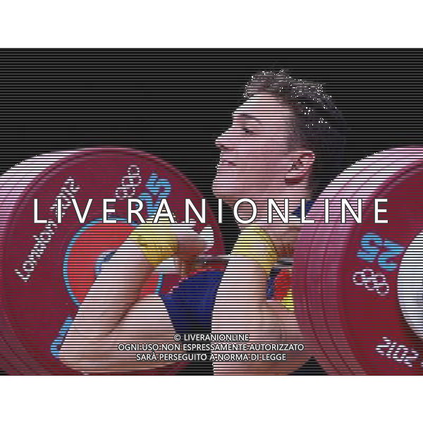 (120801) -- LONDON, Aug. 1, 2012 () -- Andres Eduardo Mata Perez of Spain competes in men\'s weightlifting 77kg group B contest, at London 2012 Olympic Games in London, Britain, on August 1, 2012. Andres Eduardo Mata Perez of Spain ranks first. (/Chen Jianli) (nxl) ©PHOTOSHOT/AGENZIA ALDO LIVERANI SAS - ITALY ONLY - GIOCHI OLIMPICI, OLIMPIADI LONDRA 2012
