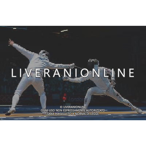 (120801) -- LONDON, Aug. 1, 2012 () -- Paolo Pizzo of Italy competes with Leung Ka Ming of Chinese Hong Kong during men\'s fencing Epee individual round of 32 match, at London 2012 Olympic Games in London, Britain, on August 1, 2012. Paolo Pizzo of Italy defeated Leung Ka Ming of Chinese Hong Kong 15-14. (/Zeng Yi) (nxl) ©PHOTOSHOT/AGENZIA ALDO LIVERANI SAS - ITALY ONLY - GIOCHI OLIMPICI, OLIMPIADI LONDRA 2012