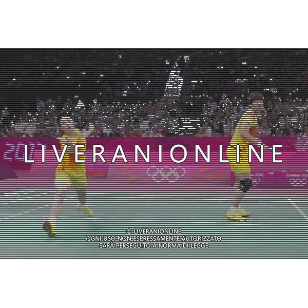 (120801) -- LONDON, Aug. 1, 2012 () -- Yu Yang (L) and Wang Xiaoli of China competes in women\'s badminton doubles group play stage match, at London 2012 Olympic Games in London, Britain, on July 31, 2012. Eight badminton players accused of deliberately losing points on Tuesday were disqualified from the Olympic women\'s doubles event by the Badminton World Federation on Wednesday, a source told on Wednesday afternoon. Top seeds and world champions Wang Xiaoli and Yu Yang from China were among the four pairs expelled over charges of throwing matches to secure an easier draw in next round. Also disqualied were Jung Kyun-Eun, Kim Ha-Na, Ha Jung-Eun and Kim Min-Jung, alll of South Korea, and Indonesia\'s Meiliana Jauhari and Greysia Polii. (/Tang Shi) (nxl) ©PHOTOSHOT/AGENZIA ALDO LIVERANI SAS - ITALY ONLY - GIOCHI OLIMPICI, OLIMPIADI LONDRA 2012
