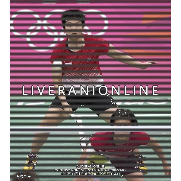 (120801) -- LONDON, Aug. 1, 2012 () -- Meiliana Jauhari and Greysia Polii of Indonesia take part in women\'s badminton doubles group play stage match, at London 2012 Olympic Games in London, Britain, on July 31, 2012. Eight badminton players accused of deliberately losing points on Tuesday were disqualified from the Olympic women\'s doubles event by the Badminton World Federation on Wednesday, a source told on Wednesday afternoon. Top seeds and world champions Wang Xiaoli and Yu Yang from China were among the four pairs expelled over charges of throwing matches to secure an easier draw in next round. Also disqualied were Jung Kyung-Eun, Kim Ha-Na, Ha Jung-Eun and Kim Min-Jung, alll of South Korea, and Indonesia\'s Meiliana Jauhari and Greysia Polii. (/Tang Shi) (nxl) ©PHOTOSHOT/AGENZIA ALDO LIVERANI SAS - ITALY ONLY - GIOCHI OLIMPICI, OLIMPIADI LONDRA 2012