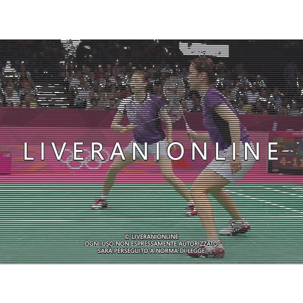 (120801) -- LONDON, Aug. 1, 2012 () -- Jung Kyung-Eun and Kim Ha-Na of South Korea competes in women\'s badminton doubles group play stage match, at London 2012 Olympic Games in London, Britain, on July 31, 2012. Eight badminton players accused of deliberately losing points on Tuesday were disqualified from the Olympic women\'s doubles event by the Badminton World Federation on Wednesday, a source told on Wednesday afternoon. Top seeds and world champions Wang Xiaoli and Yu Yang from China were among the four pairs expelled over charges of throwing matches to secure an easier draw in next round. Also disqualied were Jung Kyung-Eun, Kim Ha-Na, Ha Jung-Eun and Kim Min-Jung, alll of South Korea, and Indonesia\'s Meiliana Jauhari and Greysia Polii. (/Tang Shi) (nxl) ©PHOTOSHOT/AGENZIA ALDO LIVERANI SAS - ITALY ONLY - GIOCHI OLIMPICI, OLIMPIADI LONDRA 2012