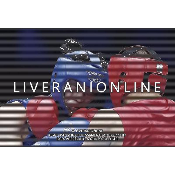 (120801) -- LONDON, Aug. 1, 2012 () -- Wang Xuanxuan of China (in blue) fights with Tervel Pulev of Bulgaria during men\'s boxing heavy (91kg) preliminaries session 9 contest, at London 2012 Olympic Games in London, Britain, on August 1, 2012. Wang Xuanxuan of China lost 7-10. (/Wang Shen) (nxl) ©PHOTOSHOT/AGENZIA ALDO LIVERANI SAS - ITALY ONLY - GIOCHI OLIMPICI, OLIMPIADI LONDRA 2012