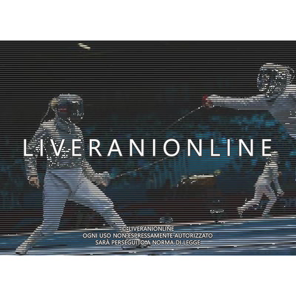 (120801) -- LONDON, Aug. 1, 2012 () -- Mariel Zagunis of USA (L) competes with Diah Permatasari of Indonesia during women\'s fencing Sabre individual round of 32 contest, at London 2012 Olympic Games in London, Britain, on August 1, 2012. Mariel Zagunis of USA defeated Diah Permatasari of Indonesia 15-7. (/Zeng Yi) (nxl) ©PHOTOSHOT/AGENZIA ALDO LIVERANI SAS - ITALY ONLY - GIOCHI OLIMPICI, OLIMPIADI LONDRA 2012