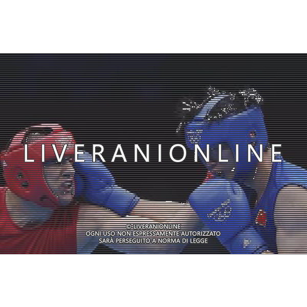 (120801) -- LONDON, Aug. 1, 2012 () -- Wang Xuanxuan of China (in blue) fights with Tervel Pulev of Bulgaria during men\'s boxing heavy (91kg) preliminaries session 9 contest, at London 2012 Olympic Games in London, Britain, on August 1, 2012. Wang Xuanxuan of China lost 7-10. (/Wang Shen) (nxl) /ALDO LIVERANI SAS-ITALY ONLY - EDITORIAL USE ONLY