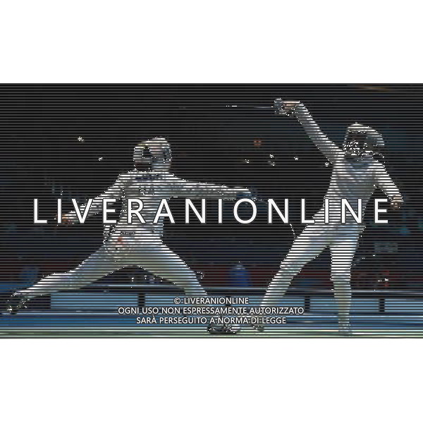 (120801) -- LONDON, Aug. 1, 2012 () -- Irene Vecchi of Italy (L) competes with Chen Xiaodong of China during the women\'s individual Sabre round of 16 match at London 2012 Olympic Games, London, Britain, Aug. 1, 2012. Irene Vecchi won the match 15-10 and advanced to the quarterfinals. (/Wang Qingqin) /ALDO LIVERANI SAS-ITALY ONLY - EDITORIAL USE ONLY