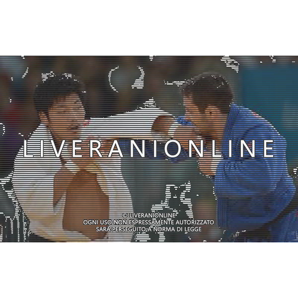 (120801) -- LONDON, Aug. 1, 2012 () -- Masashi Nishiyama of Japan (in white) competes with Kirill Denisov of Russia during men\'s Judo 90kg bronze medal contest, at London 2012 Olympic Games in London, Britain, on August 1, 2012. Masashi Nishiyama of Japan defeated Kirill Denisov of Russia. (/Wu Xiaoling) (nxl) /ALDO LIVERANI SAS-ITALY ONLY - EDITORIAL USE ONLY