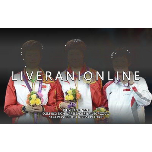 (120801) -- LONDON, Aug. 1, 2012 () -- Gold medalist Li Xiaoxia of China (C), silver medalist Ding Ning of China (L), and bronze medalist Feng Tianwei of Singapore pose at the awarding ceremony of table tennis women\'s singles event at London 2012 Olympic Games, London, Britain, Aug. 1, 2012. (/Wang Yuguo) /ALDO LIVERANI SAS-ITALY ONLY - EDITORIAL USE ONLY