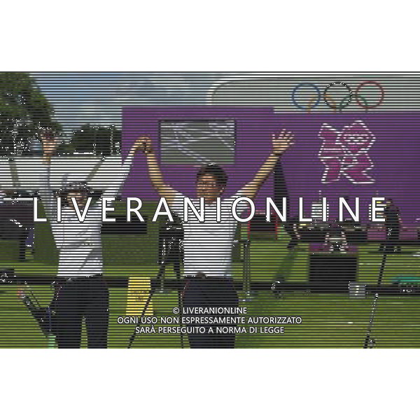 (120802) -- LONDON, Aug. 2, 2012 () -- Ki Bo Bae of South Korea celebrates with her coach after women\'s individual final of archery event, at London 2012 Olympic Games in London, Britain, August 2, 2012. Ki Bo Bae won the gold medal. (/Tao Xiyi) (zgp) /PHOTOSHOT/ALDO LIVERANI ITALY ONLY -
