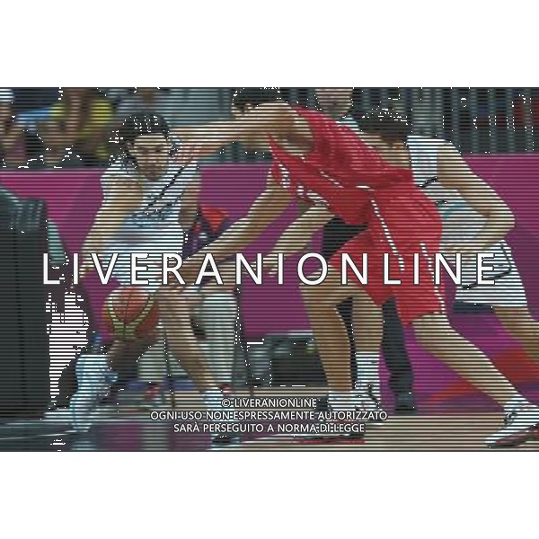 (120802) -- LONDON, Aug. 2, 2012 () -- Players compete during men\'s basketball preliminary round group A contest between Argentina and Tunisia, at London 2012 Olympic Games in London, Britain, on August 2, 2012. Argentina won 92-69. (/Meng Yongmin) (nxl) /PHOTOSHOT/ALDO LIVERANI ITALY ONLY -