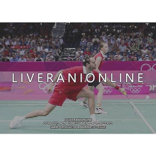 (120802) -- LONDON, Aug. 2, 2012 () -- Joachim Fischer/Christinna Pedersen of Denmark compete during badminton mixed doubles semifinal match, at London 2012 Olympic Games in London, Britain, on August 2, 2012. Zhang Nan/Zhao Yunlei of China defeated Joachim Fischer/Christinna Pedersen of Denmark 2-1. (/Tang Shi) (nxl) /PHOTOSHOT/ALDO LIVERANI ITALY ONLY -