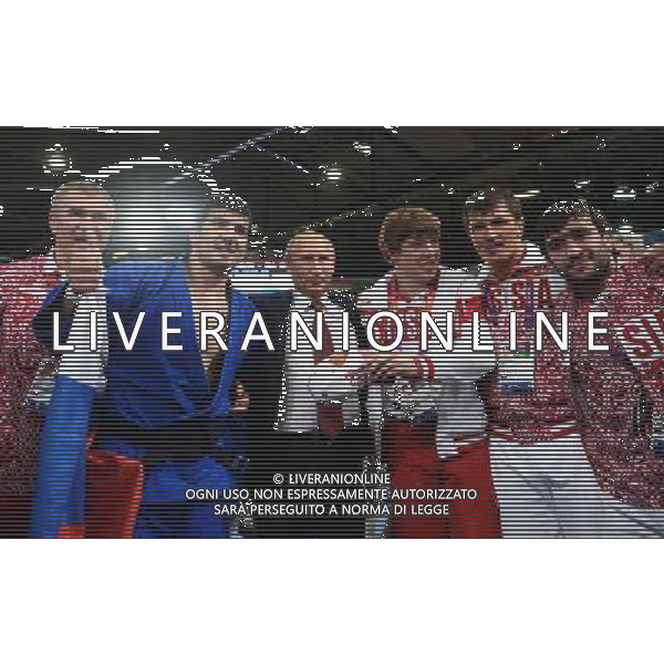 (120802) -- LONDON, Aug. 2, 2012 () -- Russian President Vladimir Putin (3rd L) poses for a group photo with Tagir Khaibulaev (2nd L) and his teammates at London 2012 Olympic Games, London, Britain, Aug. 2, 2012. Tagir Khaibulaev of Russia had just won the gold medal of men\'s 100kg judo event (/Wu Xiaoling) /PHOTOSHOT/ALDO LIVERANI ITALY ONLY -