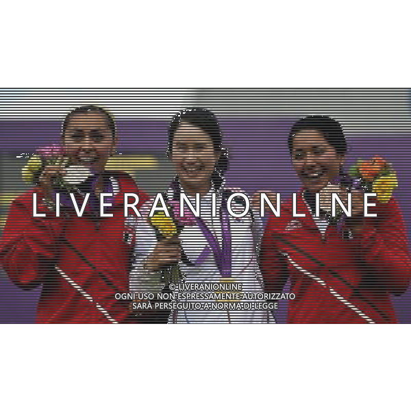 (120802) -- LONDON, Aug. 2, 2012 () -- Gold medalist Ki Bo Bae (C) of South Korea, silver medalist Aida Roman (L) of Mexico and bronze medalist Mariana Avitia of Mexico pose at the awarding ceremony of women\'s individual of archery event, at London 2012 Olympic Games in London, Britain, August 2, 2012. Ki Bo Bae won the gold medal. (/Gesang Dawa) (zgp) /PHOTOSHOT/ALDO LIVERANI ITALY ONLY -