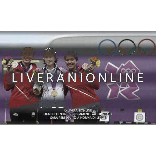 (120802) -- LONDON, Aug. 2, 2012 () -- Gold medalist Ki Bo Bae(C) of South Korea, silver medalist Aida Roman (L) of Mexico and bronze medalist Mariana Avitia of Mexico pose at the awarding ceremony of women\'s individual of archery event, at London 2012 Olympic Games in London, Britain, August 2, 2012. Ki Bo Bae won the gold medal. (/Gesang Dawa) (zgp) /PHOTOSHOT/ALDO LIVERANI ITALY ONLY -