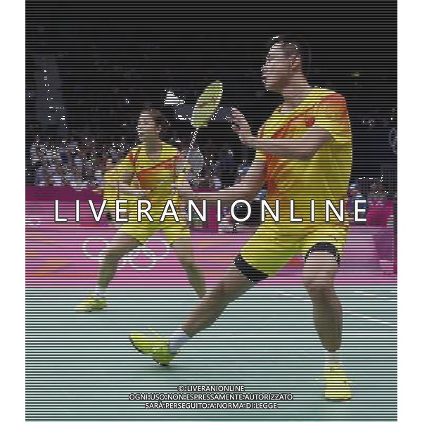 (120802) -- LONDON, Aug. 2, 2012 () -- Xu Chen (front) and Ma Jin of China celebrate after winning the semifinals match of mixed doubles badminton event against Tontowi Ahmad and Liliyana Natsir of Indonesia at London 2012 Olympic Games, London, Britain, Aug. 2, 2012. Xu Chen/Ma Jin won the match 2-1. (/Tang Shi) /PHOTOSHOT/ALDO LIVERANI ITALY ONLY -