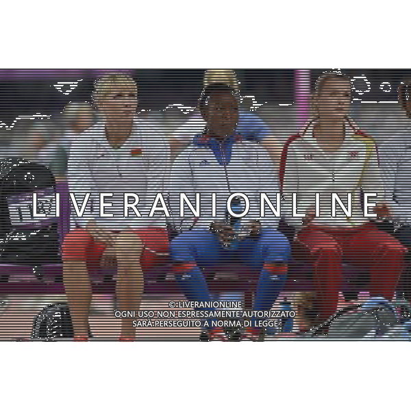 Heptathlon Athletes resting under shelter prior to competition . Olympic Stadium, Olympic Park Stratford. London. ©PHOTOSHOT/Agenzia Aldo Liverani Sas - ITALY ONLY - GIOCHI OLIMPICI, OLIMPIADI LONDRA 2012