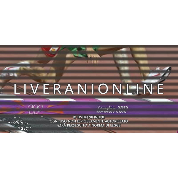Athletes clear the barrier in the men\'s 3000m steeplechase. Olympic Stadium, Olympic Park Stratford. London. ©PHOTOSHOT/Agenzia Aldo Liverani Sas - ITALY ONLY - GIOCHI OLIMPICI, OLIMPIADI LONDRA 2012