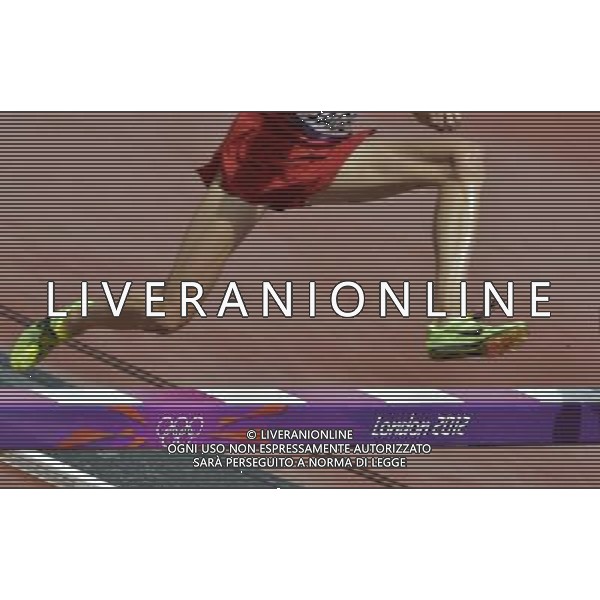 Athletes clear the barrier in the men\'s 3000m steeplechase. Olympic Stadium, Olympic Park Stratford. London. ©PHOTOSHOT/Agenzia Aldo Liverani Sas - ITALY ONLY - GIOCHI OLIMPICI, OLIMPIADI LONDRA 2012