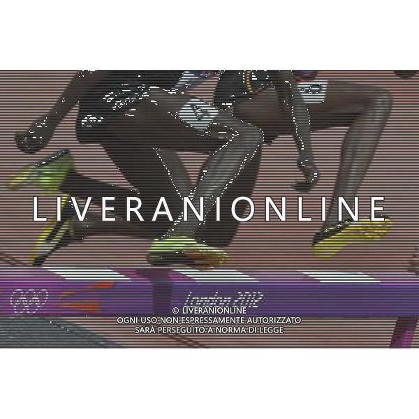 Athletes clear the barrier in the men\'s 3000m steeplechase. Olympic Stadium, Olympic Park Stratford. London. ©PHOTOSHOT/Agenzia Aldo Liverani Sas - ITALY ONLY - GIOCHI OLIMPICI, OLIMPIADI LONDRA 2012