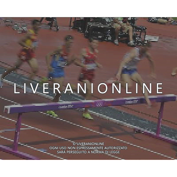 Athletes clearing a Barrier during the men\'s 3000m steeplechase. Olympic Stadium, Olympic Park Stratford. London. ©PHOTOSHOT/Agenzia Aldo Liverani Sas - ITALY ONLY - GIOCHI OLIMPICI, OLIMPIADI LONDRA 2012