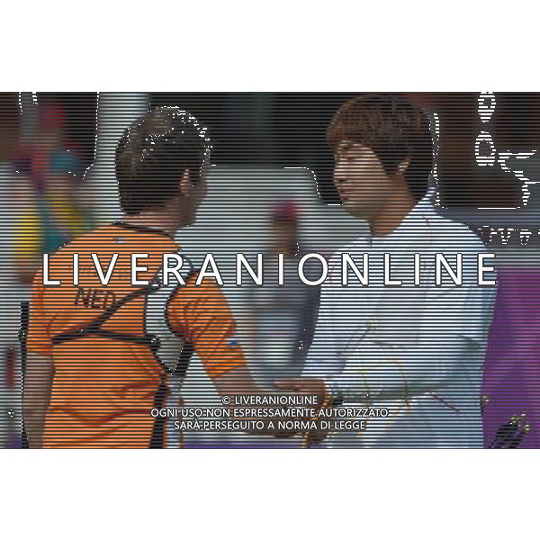 (120803) -- LONDON, Aug. 3, 2012 () -- Im Dong Hyun of South Korea (R) shakes hands with Rick van der Ven of the Netherlands after men\'s archery individual 1/8 eliminations contest, at London 2012 Olympic Games in London, Britain, on August 3, 2012. Im Dong Hyun of South Korea lost to Rick van der Ven of the Netherlands 1-7. (/Gesang Dawa) (nxl) ©PHOTOSHOT/Agenzia Aldo Liverani Sas - ITALY ONLY - GIOCHI OLIMPICI, OLIMPIADI LONDRA 2012