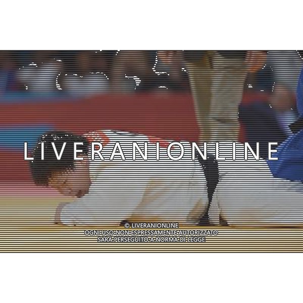 (120803) -- LONDON, Aug. 3, 2012 () -- Tong Wen of China (in white) takes part in women\'s Judo +78kg semifinal contest, at London 2012 Olympic Games in London, Britain, on August 3, 2012. Tong Wen of China lost to Idalys Ortiz of Cuba. (/Wu Xiaoling) (nxl) ©PHOTOSHOT/Agenzia Aldo Liverani Sas - ITALY ONLY - GIOCHI OLIMPICI, OLIMPIADI LONDRA 2012